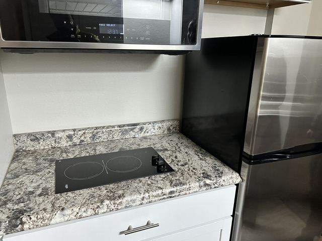 Kitchen appliance and counter detail at Aero Apartments
